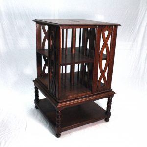 Compact Revolving Bookcase in figured oak